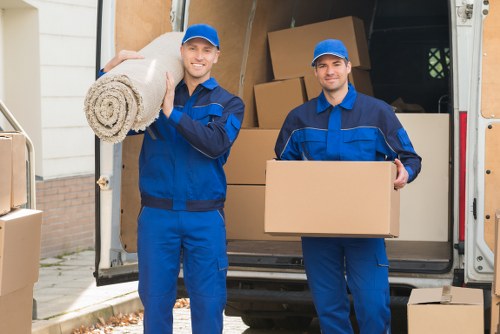 Professional movers loading office equipment for an Edenpark relocation