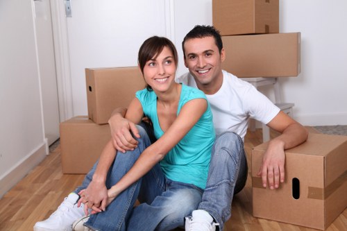 Professional movers handling boxes with care
