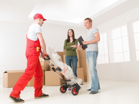 Packed boxes and furniture ready for local transport