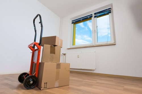Packed moving boxes and furniture ready for transport